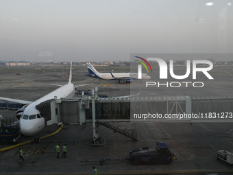 An IndiGo Airlines aircraft taxis on the tarmac at the Netaji Subhash Chandra Bose International Airport in Kolkata, India, on December 3, 2...