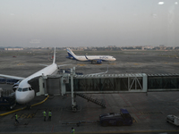 An IndiGo Airlines aircraft taxis on the tarmac at the Netaji Subhash Chandra Bose International Airport in Kolkata, India, on December 3, 2...