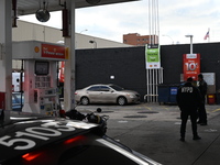 Two men are stabbed during an attempted robbery of a vehicle at a Shell gas station in the Sunset Park section of Brooklyn, New York, United...