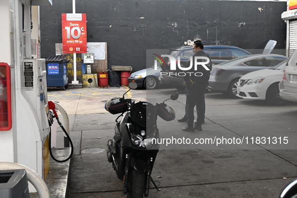 Two men are stabbed during an attempted robbery of a vehicle at a Shell gas station in the Sunset Park section of Brooklyn, New York, United...