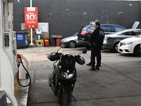 Two men are stabbed during an attempted robbery of a vehicle at a Shell gas station in the Sunset Park section of Brooklyn, New York, United...