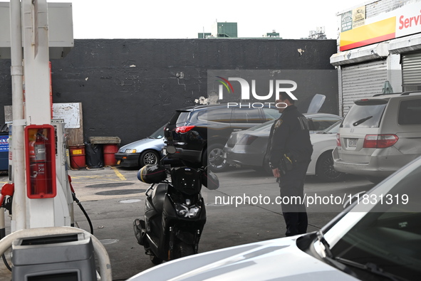 Two men are stabbed during an attempted robbery of a vehicle at a Shell gas station in the Sunset Park section of Brooklyn, New York, United...