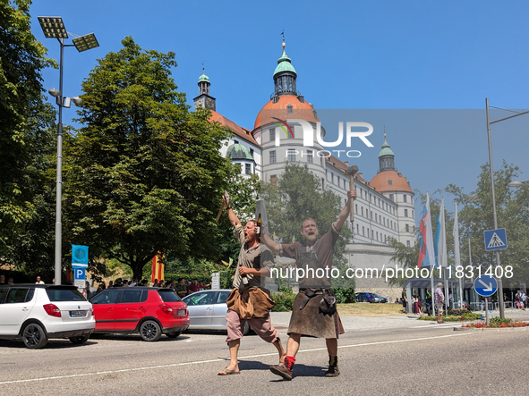 In Neuburg an der Donau, Germany, on July 9, 2023, the city hosts a grand historical parade as part of its annual castle festival. Around 2,...