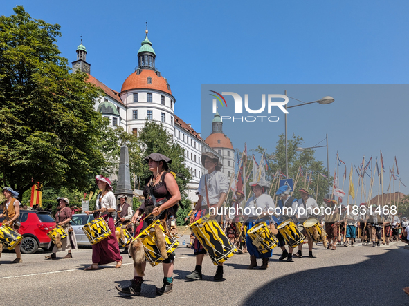 In Neuburg an der Donau, Germany, on July 9, 2023, the city hosts a grand historical parade as part of its annual castle festival. Around 2,...