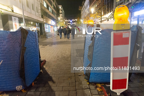 The barriers are seen as closed at the Bochum Christmas market in Bochum, Germany, on December 3, 2024, as several large anti-terror vehicle...