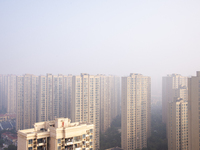 Buildings loom in the morning fog in Ningbo, Zhejiang province, China, on December 3, 2024. (