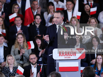 Karol Nawrocki, a Polish historian and president of the Institute of National Remembrance, is presented as the presidential candidate during...