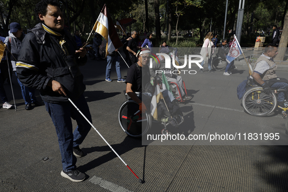 On December 3, 2024, in Mexico City, Mexico, dozens of people with disabilities and wheelchair users demonstrate on the occasion of the Inte...