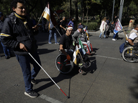 On December 3, 2024, in Mexico City, Mexico, dozens of people with disabilities and wheelchair users demonstrate on the occasion of the Inte...