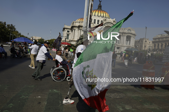 People with disabilities demonstrate on the occasion of the International Day of Persons with Disabilities, marching on Avenida Juarez to th...