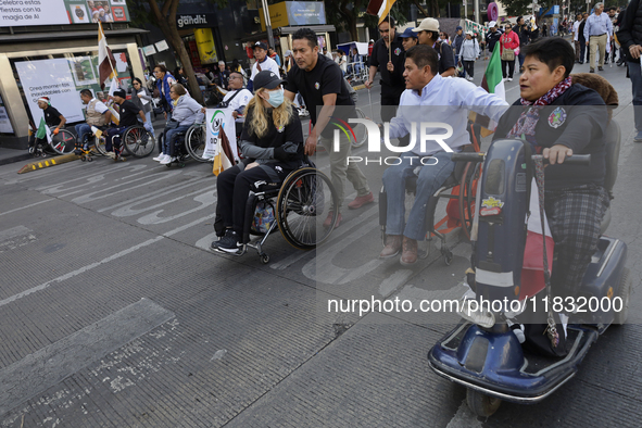 On December 3, 2024, in Mexico City, Mexico, dozens of people with disabilities and wheelchair users demonstrate on the occasion of the Inte...