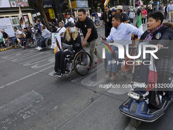 On December 3, 2024, in Mexico City, Mexico, dozens of people with disabilities and wheelchair users demonstrate on the occasion of the Inte...