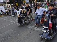 On December 3, 2024, in Mexico City, Mexico, dozens of people with disabilities and wheelchair users demonstrate on the occasion of the Inte...