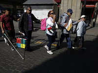 People with disabilities demonstrate on the occasion of the International Day of Persons with Disabilities, marching on Avenida Juarez to th...