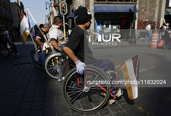 On December 3, 2024, in Mexico City, Mexico, dozens of people with disabilities and wheelchair users demonstrate on the occasion of the Inte...