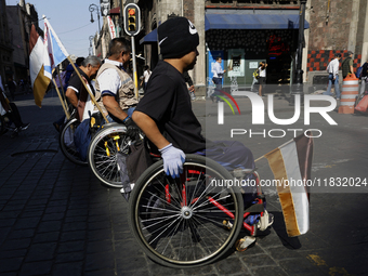 On December 3, 2024, in Mexico City, Mexico, dozens of people with disabilities and wheelchair users demonstrate on the occasion of the Inte...