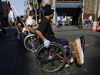 On December 3, 2024, in Mexico City, Mexico, dozens of people with disabilities and wheelchair users demonstrate on the occasion of the Inte...