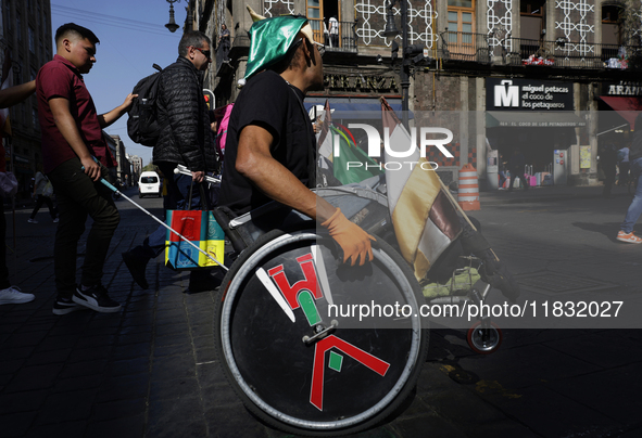 On December 3, 2024, in Mexico City, Mexico, dozens of people with disabilities and wheelchair users demonstrate on the occasion of the Inte...