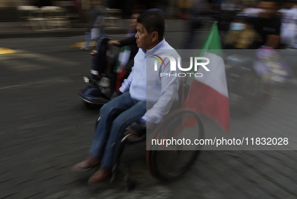 On December 3, 2024, in Mexico City, Mexico, dozens of people with disabilities and wheelchair users demonstrate on the occasion of the Inte...