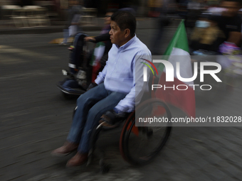 On December 3, 2024, in Mexico City, Mexico, dozens of people with disabilities and wheelchair users demonstrate on the occasion of the Inte...