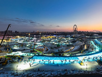 An ice sculpture is under construction at the 26th Ice and Snow World in Harbin, China, on December 3, 2024. (