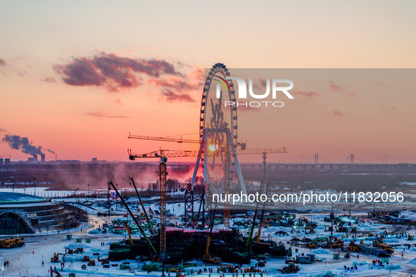 An ice sculpture is under construction at the 26th Ice and Snow World in Harbin, China, on December 3, 2024. 