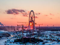 An ice sculpture is under construction at the 26th Ice and Snow World in Harbin, China, on December 3, 2024. (