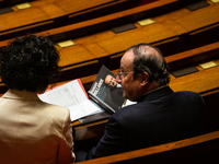 Francois Hollande, former French President and now deputy of the Socialistes et Apparentes group, holds his book at the National Assembly in...