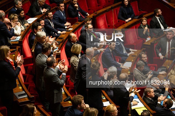 Deputies of Droite Republicaine argue with deputies of Rassemblement National during the questions to the government session at the National...