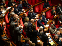 Deputies of Droite Republicaine argue with deputies of Rassemblement National during the questions to the government session at the National...