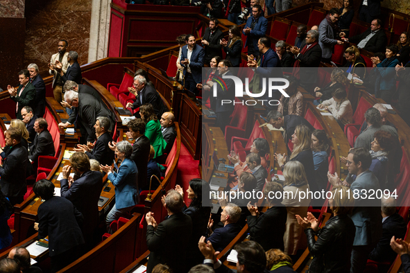 MP deputies of the left-wing parliamentary groups are seen during the session of questions to the government at the National Assembly in Par...