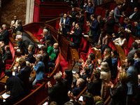 MP deputies of the left-wing parliamentary groups are seen during the session of questions to the government at the National Assembly in Par...