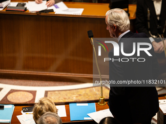 French Prime Minister Michel Barnier rises to speak at the questions to the government session at the National Assembly in Paris, France, on...