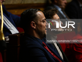 Sebastien Delogu (left) and Raphael Arnault (right), MP deputies of the La France Insoumise group, are seen during the questions to the gove...