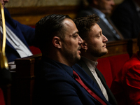 Sebastien Delogu (left) and Raphael Arnault (right), MP deputies of the La France Insoumise group, are seen during the questions to the gove...