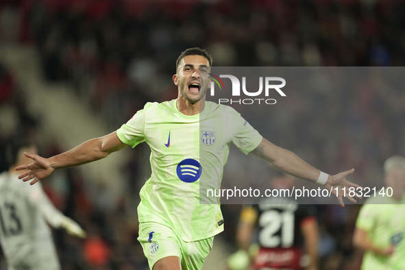 Ferran Torres left winger of Barcelona and Spain celebrates after scoring his sides first goal during the La Liga match between RCD Mallorca...