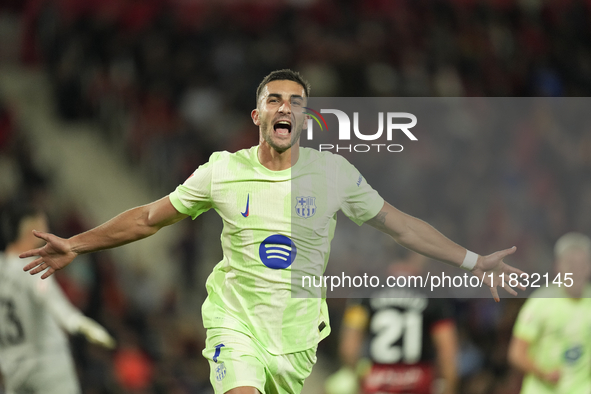 Ferran Torres left winger of Barcelona and Spain celebrates after scoring his sides first goal during the La Liga match between RCD Mallorca...