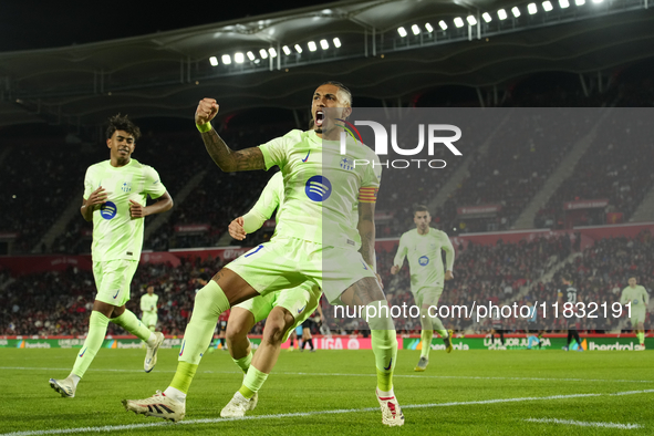 Raphinha right winger of Barcelona and Brazil celebrates after scoring his sides first goal during the La Liga match between RCD Mallorca an...