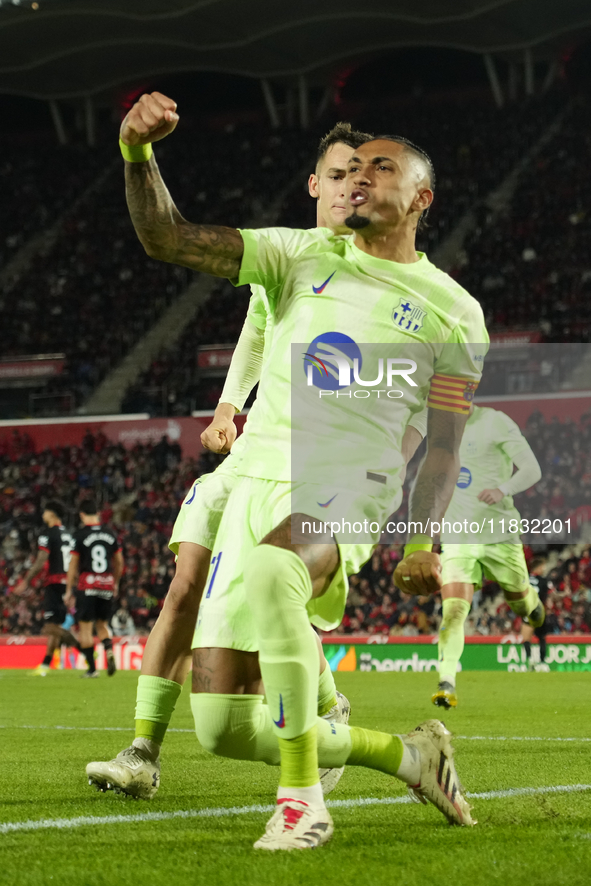 Raphinha right winger of Barcelona and Brazil celebrates after scoring his sides first goal during the La Liga match between RCD Mallorca an...