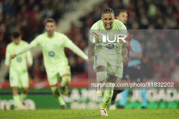 Raphinha right winger of Barcelona and Brazil celebrates after scoring his sides first goal during the La Liga match between RCD Mallorca an...