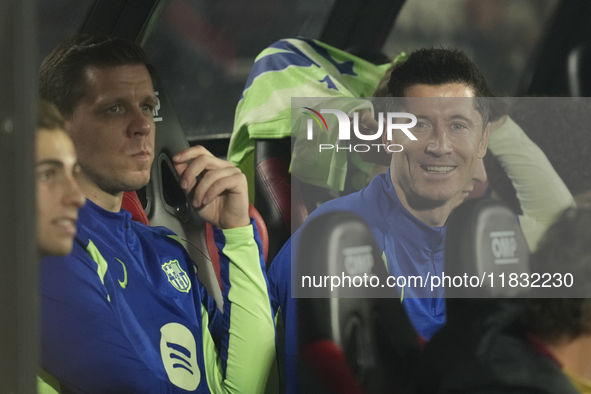 (L) Wojciech Szczesny goalkeeper of Barcelona and Poland and (R) Robert Lewandowski centre-forward of Barcelona and Poland sitting on the be...