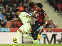 Lamine Yamal right winger of Barcelona and Spain and Johan Mojica left-back of Mallorca and Colombia compete for the ball during the La Liga...