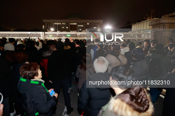 Hundreds of citizens gather in front of the National Assembly in Seoul, South Korea, on December 4, 2024, demanding the repeal of the martia...