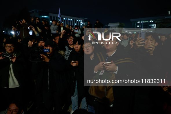 Hundreds of citizens gather in front of the National Assembly in Seoul, South Korea, on December 4, 2024, demanding the repeal of the martia...