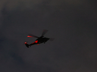 An Apache helicopter under the command of the martial law forces lands at the National Assembly building in Yeouido, in Seoul, South Korea,...