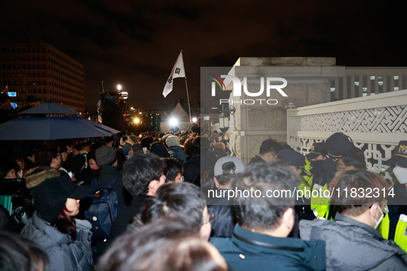 Hundreds of citizens gather in front of the National Assembly in Seoul, South Korea, on December 4, 2024, demanding the repeal of the martia...