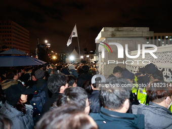 Hundreds of citizens gather in front of the National Assembly in Seoul, South Korea, on December 4, 2024, demanding the repeal of the martia...