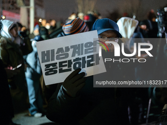 Hundreds of citizens gather in front of the National Assembly in Seoul, South Korea, on December 4, 2024, demanding the repeal of the martia...