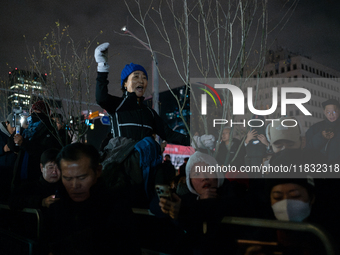 Hundreds of citizens gather in front of the National Assembly in Seoul, South Korea, on December 4, 2024, demanding the repeal of the martia...