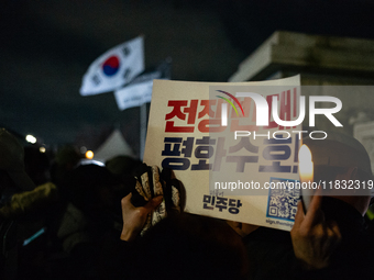 Hundreds of citizens gather in front of the National Assembly in Seoul, South Korea, on December 4, 2024, demanding the repeal of the martia...